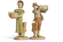 Two Worcester figures of children holding a basket decorated in shot enamels (2) 24cm tall