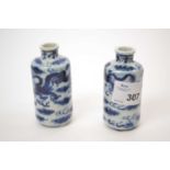 Pair of Chinese porcelain scent bottles with reign marks to base, decorated with dragons chasing the