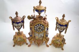 French porcelain and gilt metal mounted clock garniture of elaborate form, the clock with urn mount,