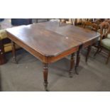 19th Century maghogany extending dining table set on turned legs with casters, 133cm wide