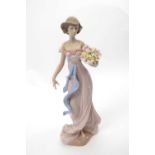 Large Lladro figure of a young girl holding a basket of flowers with Lladro factory mark and date