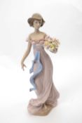 Large Lladro figure of a young girl holding a basket of flowers with Lladro factory mark and date