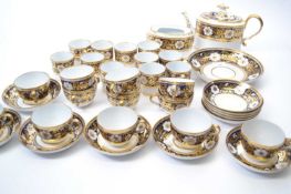 An early 19th Century New Hall or Coalport type tea set comprising twelve cups and saucers, twelve