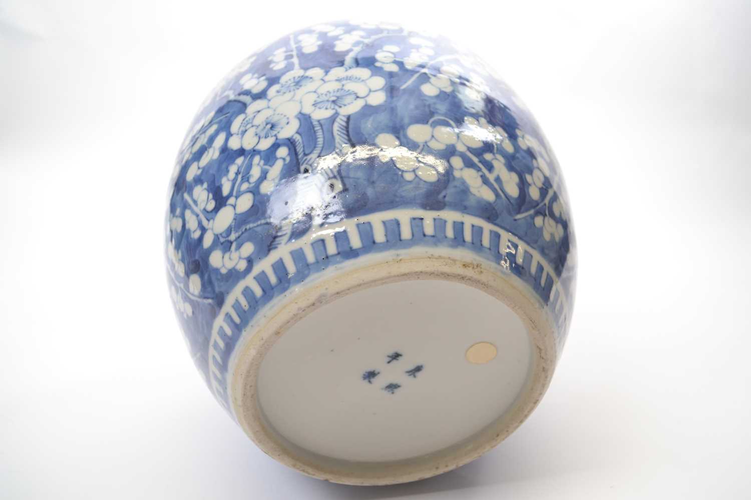 Large Chinese porcelain ginger jar decorated with prunus on a blue ground with four character mark - Image 3 of 9