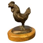 Limited edition model of a chicken marked number 56 of 350 on oval base