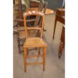Late 19th Century hardwood framed and cane seated correction chair, 96cm high