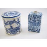 Delft jar and cover, 20th Century together with a Delft tea caddy with floral design and birds (2)