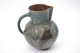 Branham Ware jug dated 1900 with a green floral design, 22cm high