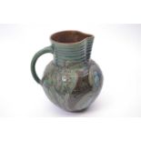 Branham Ware jug dated 1900 with a green floral design, 22cm high