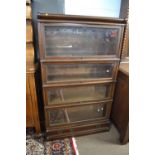 Globe Wernicke mahogany stacking bookcase cabinet formed of four glazed sections and a base