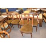 Set of six late Victorian oak framed dining chairs decorated with carved floral detail