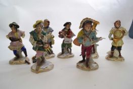 Group of seven early 20th Century Dresden monkey band figures including a conductor, drummer and