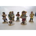 Group of seven early 20th Century Dresden monkey band figures including a conductor, drummer and