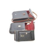 Vintage Kodak camera with two leather cases