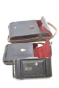 Vintage Kodak camera with two leather cases