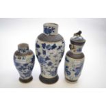 Group of three Chinese porcelain crackle ware vases one with cover, all with blue and white