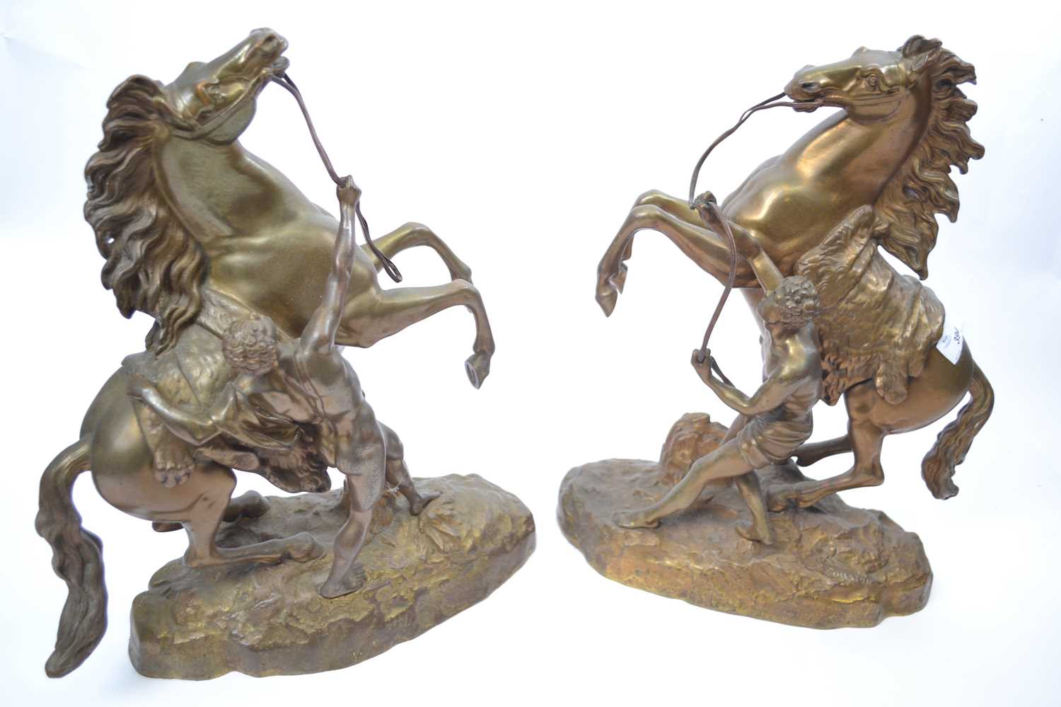 A pair of Marley horses , after Guillaume Couston (French 1677-1746), bronzed metal, signed to