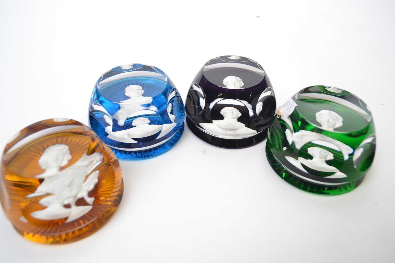 A group of four Baccarat paperweights with members of the Royal Family, Princess Anne, King