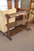 Late 19th Century dark oak three tier shelf or buffet stand with pillared side supports, 118cm wide