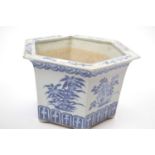 Chinese porcelain planter of hexagonal form with blue and white designs, 27cm diameter