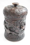 Chinese wooden cylindrical box with various carved designs and symbols including For Good Luck