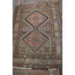 Small caucasian wool rug decorated with central medallion, brown, grey and pink background, 105 x