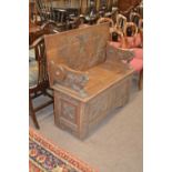 Late 19th / Early 20th Century oak monks bench with gothic carved detail and storage base, 106cm