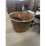 A large 20th century German wash copper with custom made iron stand . Copper diameter 75cm