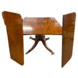 19th Century mahogany pedestal dining table with two extension leaves supported on pull out