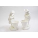Pair of 19th Century white glazed Minton figures with baskets, 22cm high