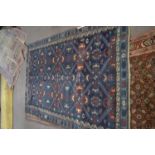 Causasian wool rug with panelled geometric patterns in blue, rust and beige, 210 x 138 cm
