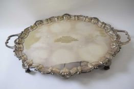 Large silver plated tray with scalloped border and handles with inscription dated 1914, 59cm width