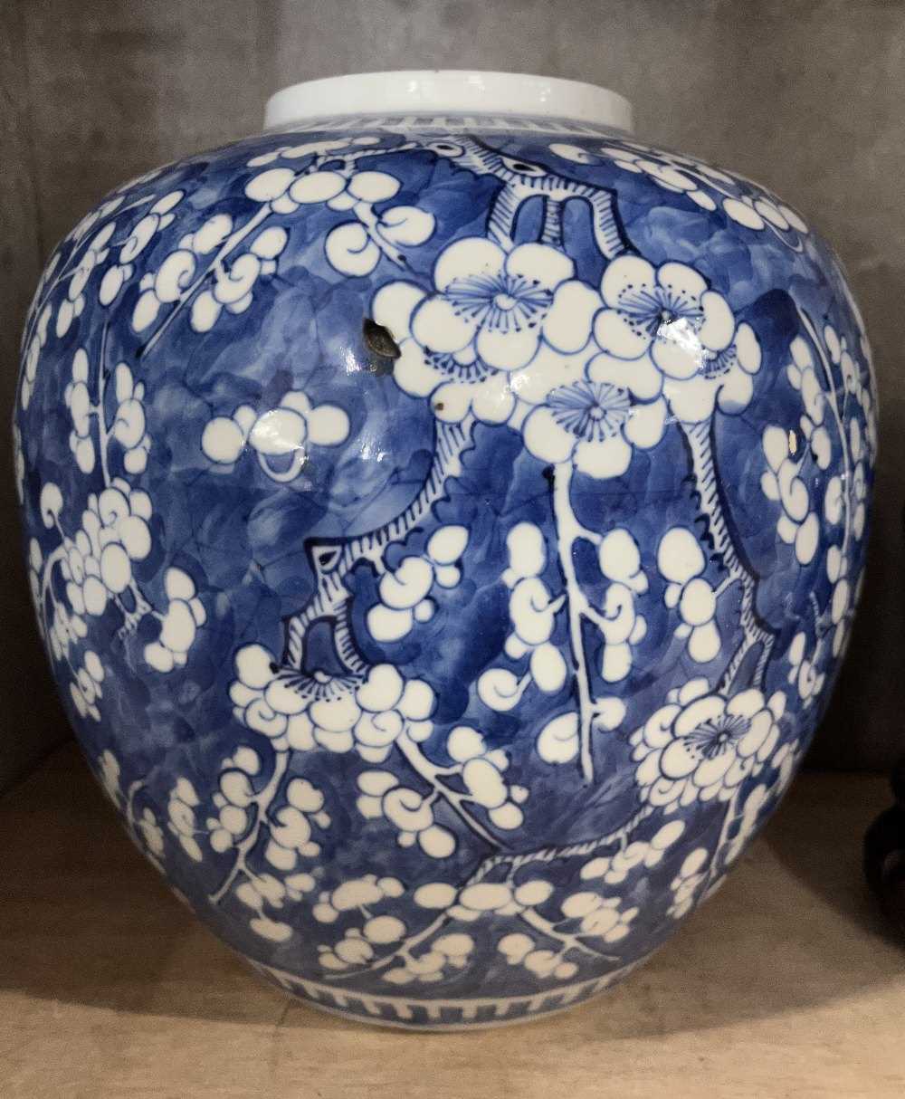 Large Chinese porcelain ginger jar decorated with prunus on a blue ground with four character mark - Image 2 of 9