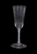 Cordial glass with drawn bowl above an opaque twist and a multi spiral tape stem, 19cm high