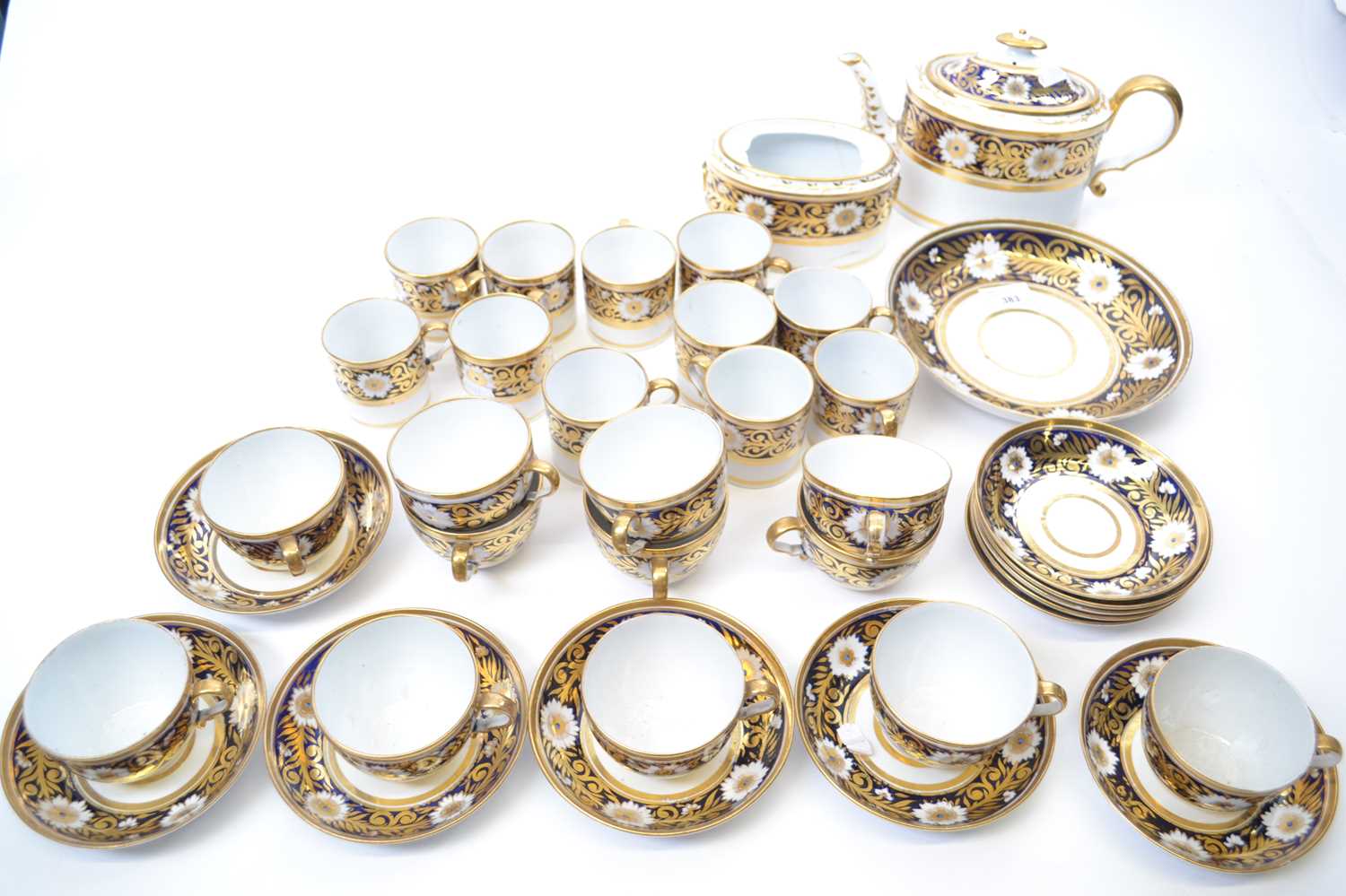An early 19th Century New Hall or Coalport type tea set comprising twelve cups and saucers, twelve - Image 2 of 3
