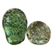 Victorian dump green glass door stop with further spherical example, tallest 18cm high