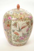 Large Chinese porcelain jar and cover decorated in Cantonese style with panels of Chinese figures