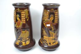 Pair of vases in Royal Doulton Kingsware style decorated with Dickins characters, no mark to base,