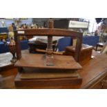 19th Century oak table top press with turned screw thread and plain side supports, 51cm wide