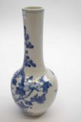Chinese porcelain vase painted with a blue and white design of a bird amongst foliage, 23cm high
