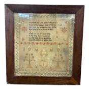 Victorian needlework sampler decorated with religious text, flowers, trees and animals surrounded by