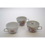 Group of three Italian porcelain cups, probably Doccia