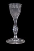 Georgian wine/cordial glass with star engraving around the bucket bowl and faceted stem, 14cm