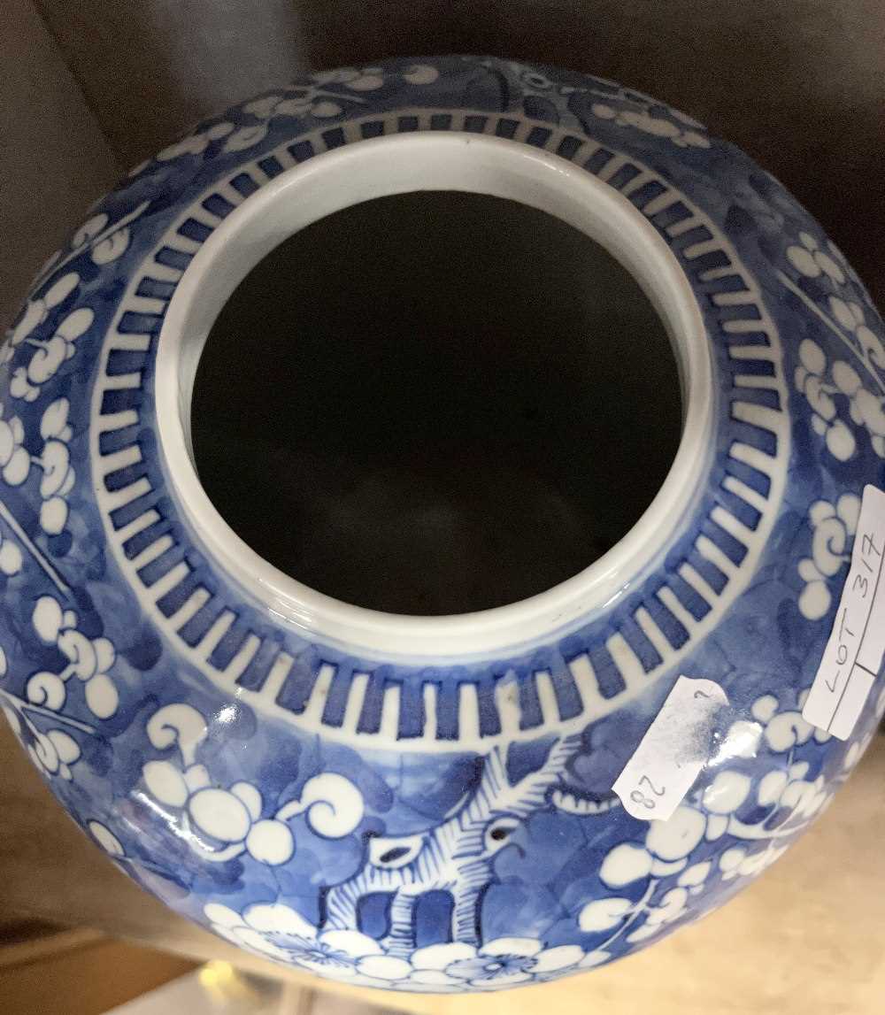 Large Chinese porcelain ginger jar decorated with prunus on a blue ground with four character mark - Image 8 of 9