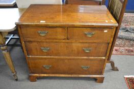 Early 18th Century walnut veneered chest of two short and two long drawers fitted with brass swan