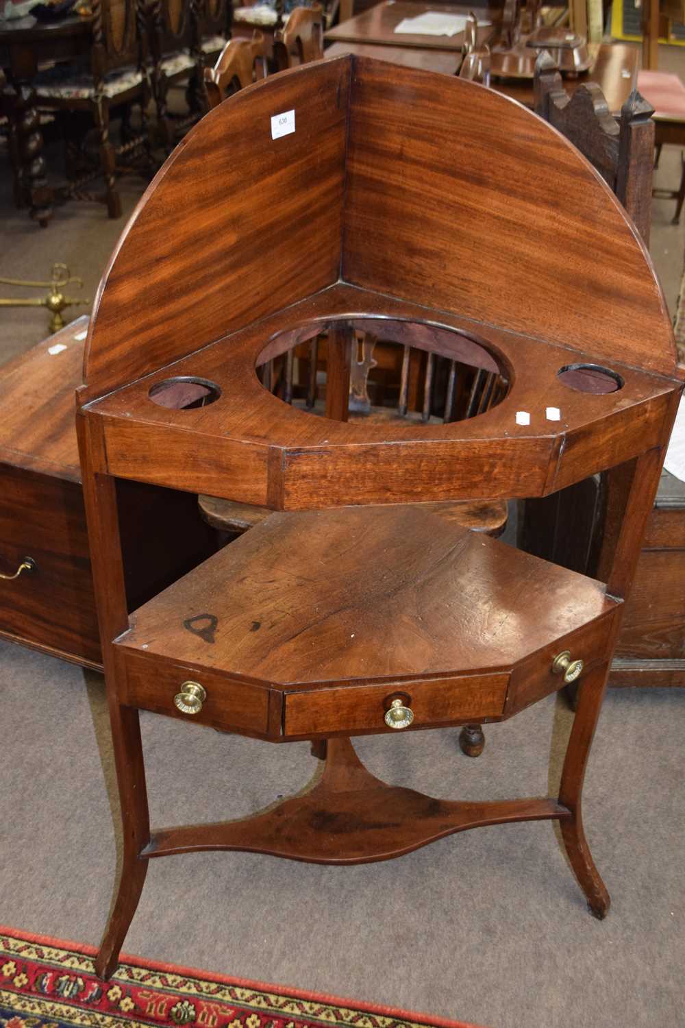 19th Century mahogany corner wash stand with galleried back and three apertures fitted with a single