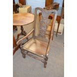 18th Century large oak armchair with carved splat back hard seat and turned front stretcher, 103cm