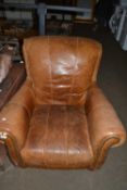 Brown leather high back armchair