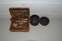 Cased vintage manicure set together with a hardwood dressing table container