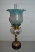 Brass based oil lamp with frosted glass shade